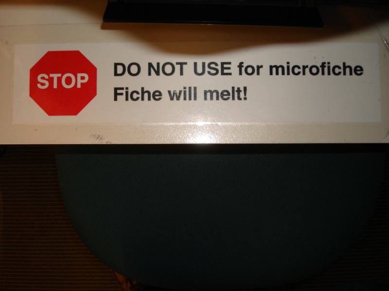 Sign saying not to use microfiche with a machine because the fiche will melt